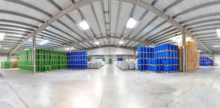 Rows of tagged chemical bins in a warehouse tracked by RTLS for inventory visibility